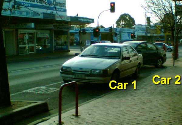 Cars trying to park on Centre Road