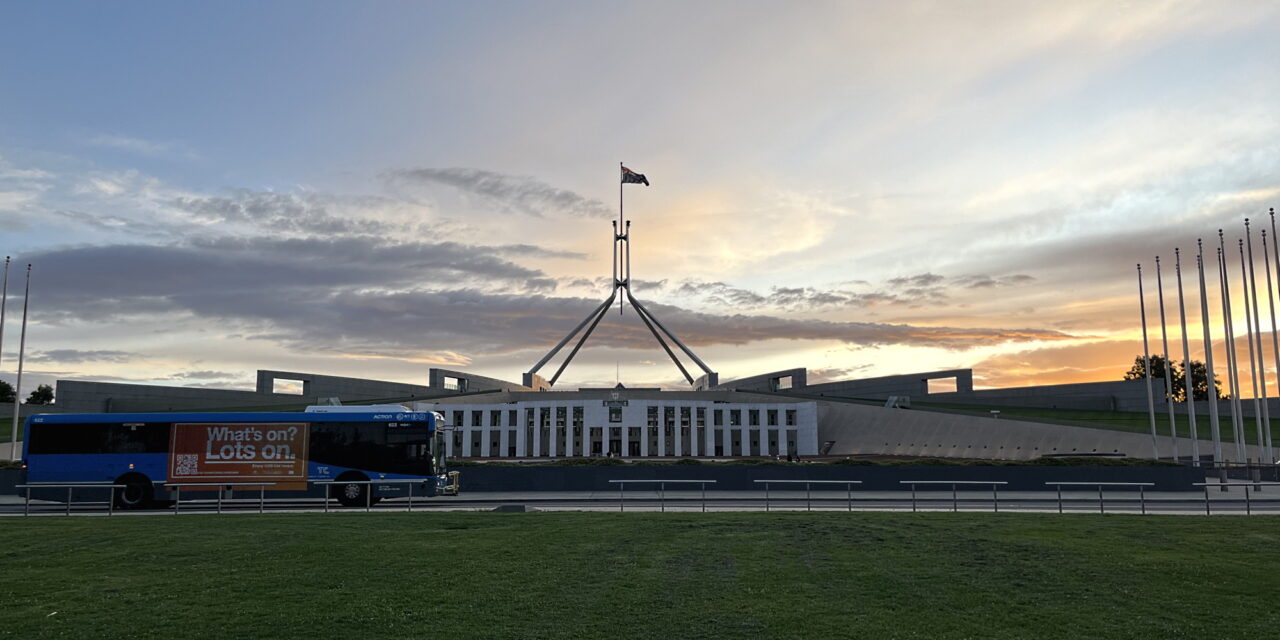 Bus passing Parliament House, Canberra
