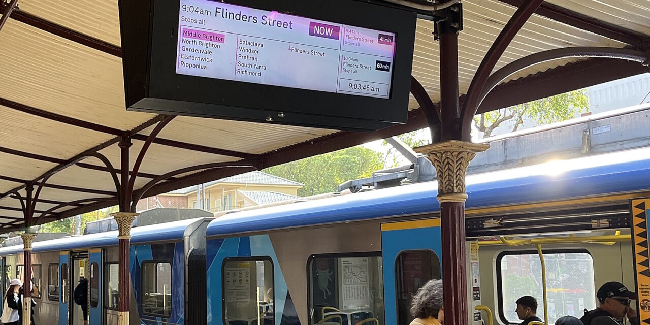 Passengers boarding a train. The next one is in 40 minutes.