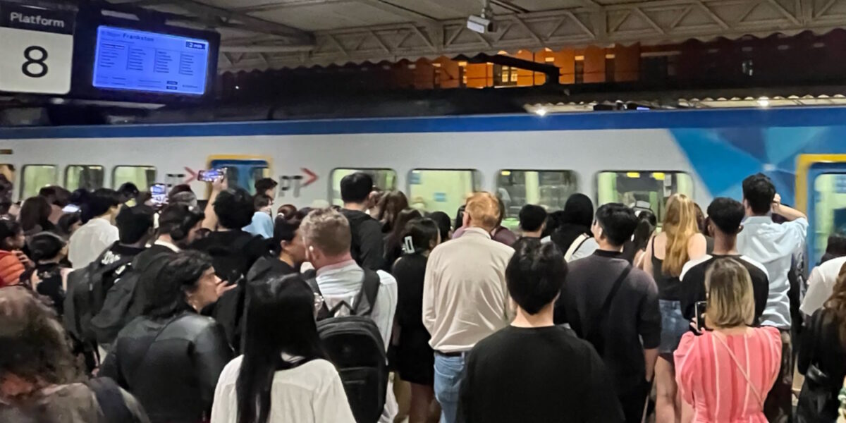 Passengers wait to board a Frankston line train at 9:30pm on a Friday night at Flinders Street station