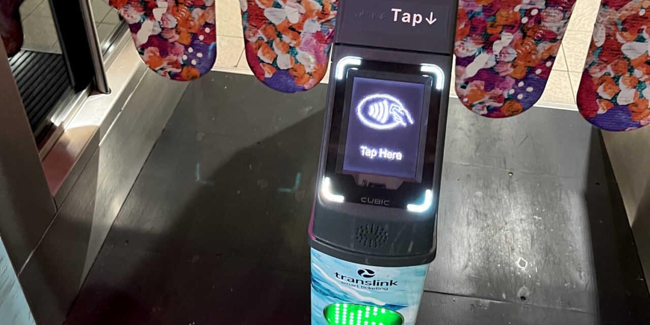 Brisbane fare gate showing Tap Here on display