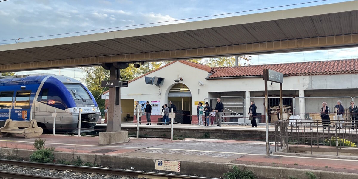 A train arriving at Arles station, France