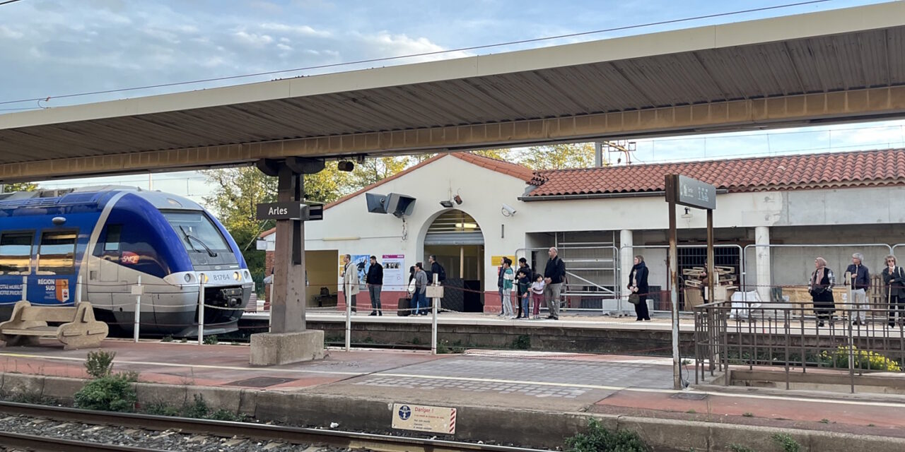 A train arriving at Arles station, France