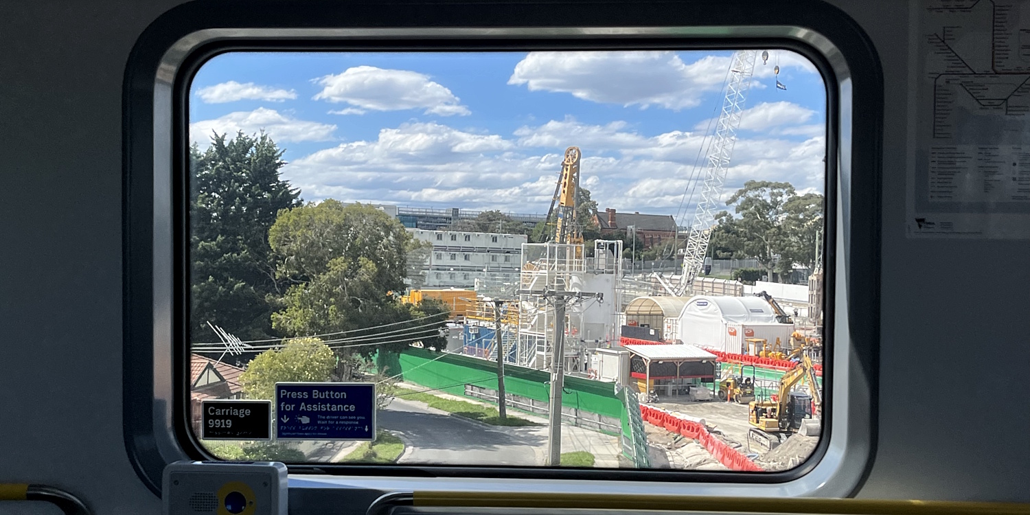 View of SRL works at Clayton, through a train window